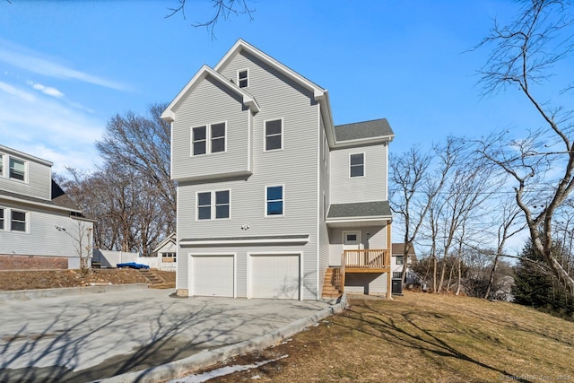 rear view of house with a garage