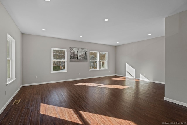 empty room featuring dark wood-type flooring