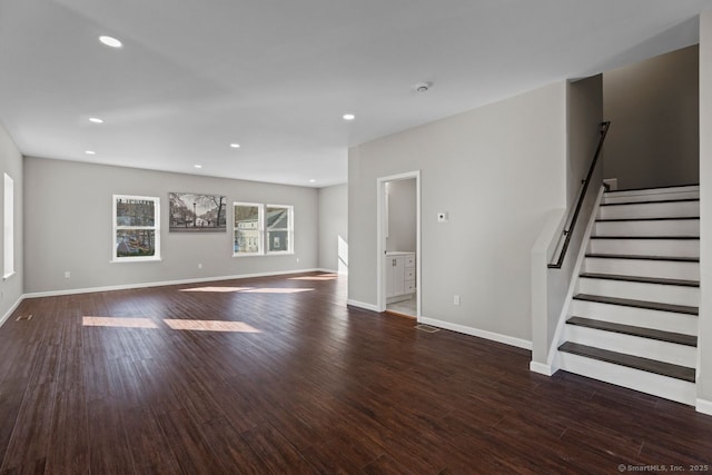 unfurnished living room with dark hardwood / wood-style floors