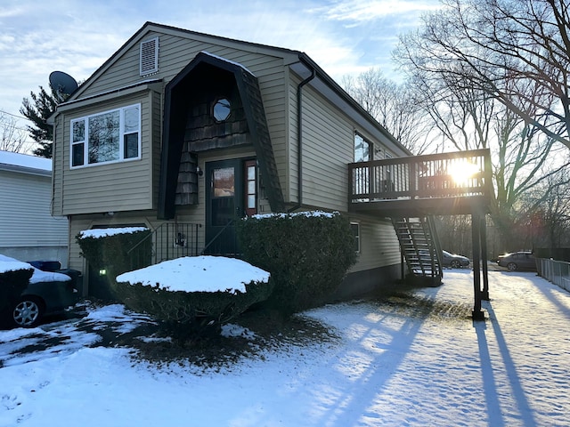 view of front of property with a wooden deck