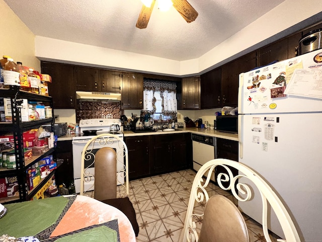 kitchen featuring ceiling fan, white appliances, dark brown cabinetry, and a textured ceiling