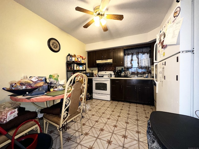 kitchen featuring ceiling fan, white appliances, dark brown cabinetry, and a textured ceiling