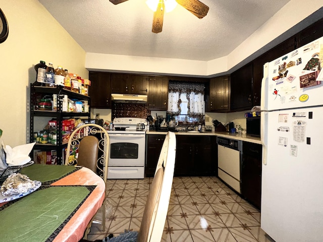 kitchen featuring dark brown cabinetry, ceiling fan, a textured ceiling, and white appliances