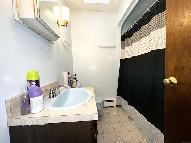 bathroom with vanity, curtained shower, baseboard heating, and toilet