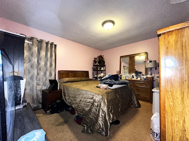 carpeted bedroom with a textured ceiling