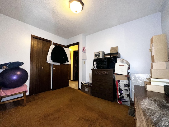 carpeted bedroom with a textured ceiling