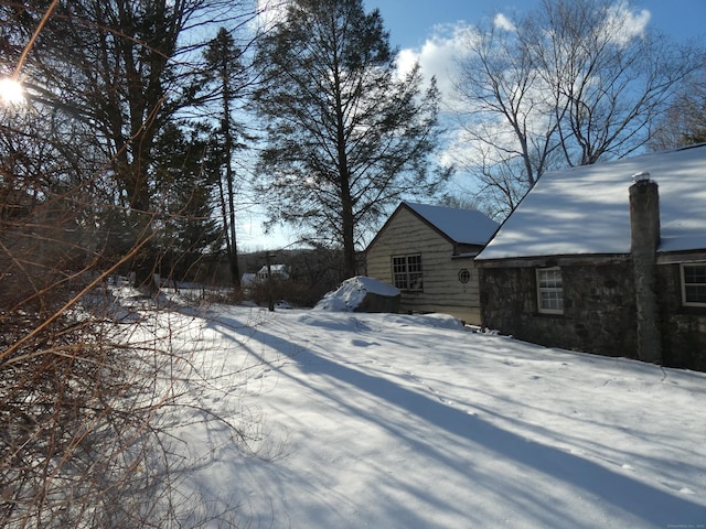 view of yard covered in snow