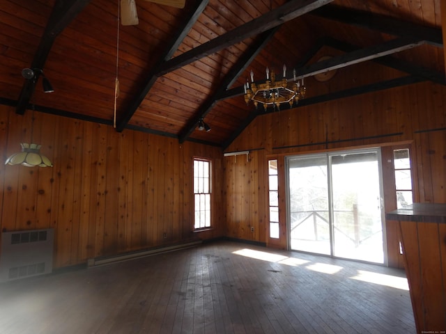 empty room featuring a baseboard radiator, wooden walls, vaulted ceiling with beams, and wood ceiling