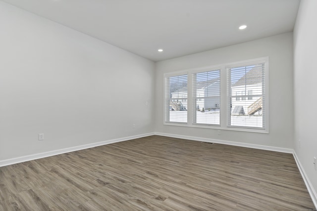 unfurnished room featuring wood-type flooring