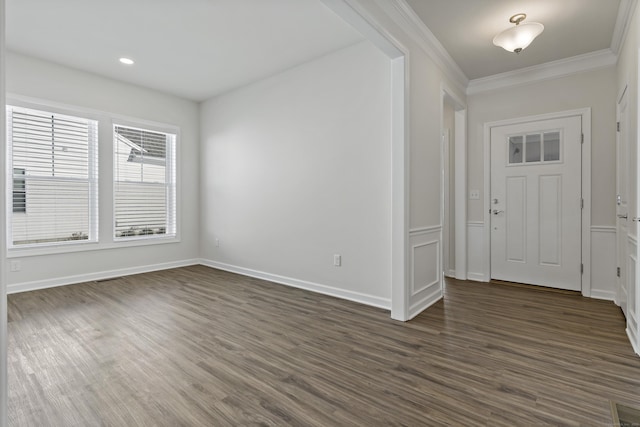 entryway with dark wood-type flooring and ornamental molding