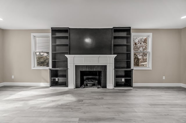 unfurnished living room featuring light hardwood / wood-style floors