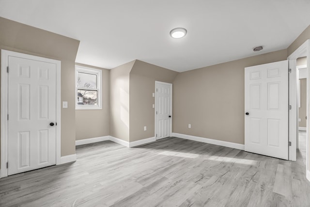 bonus room featuring light wood-type flooring