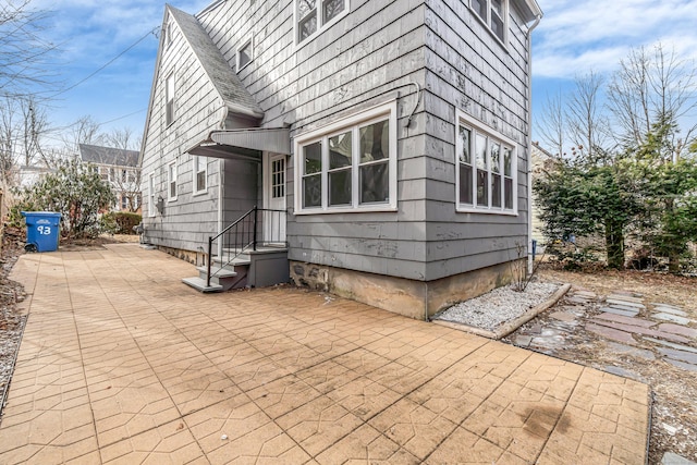 view of home's exterior with a patio