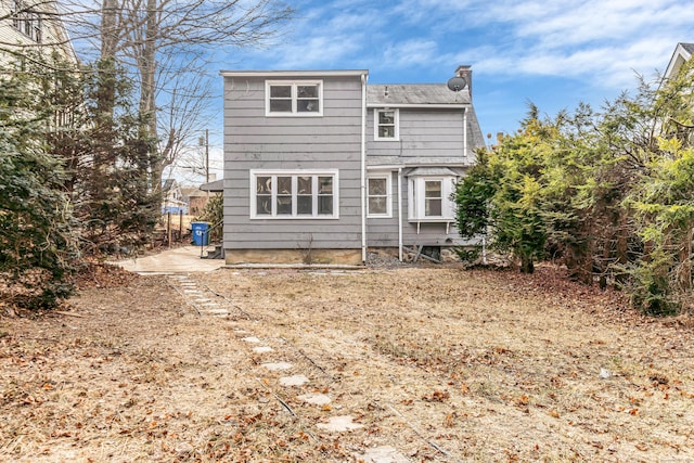 rear view of property with a patio area