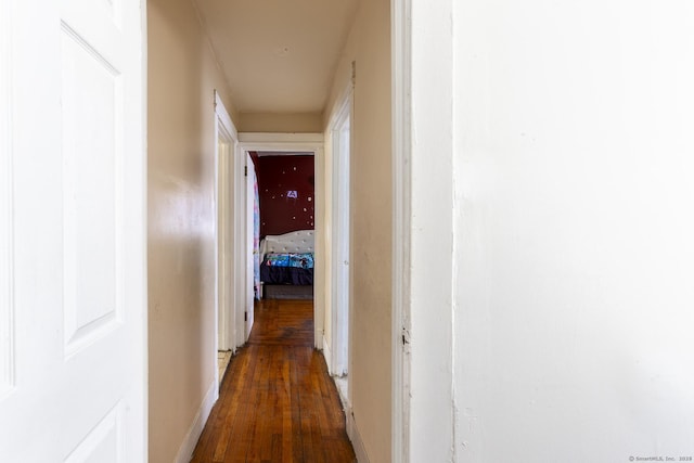 hallway featuring dark hardwood / wood-style flooring