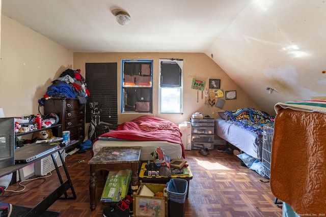 bedroom featuring vaulted ceiling and parquet floors