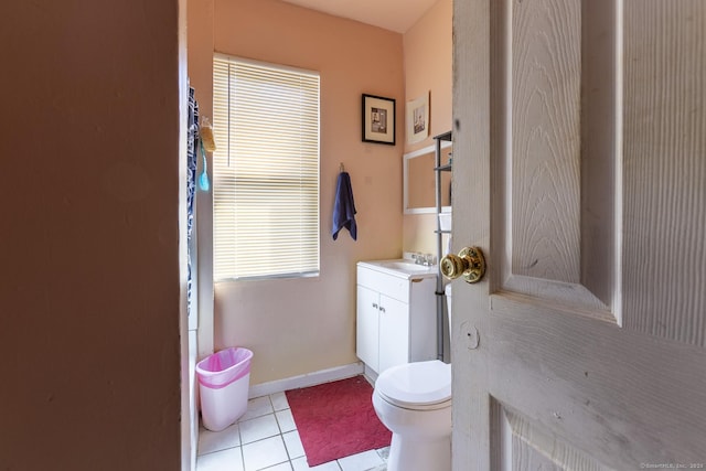 bathroom with tile patterned flooring, vanity, and toilet