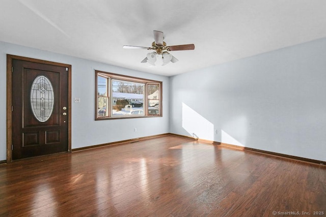 foyer with dark hardwood / wood-style floors and ceiling fan