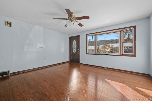 interior space featuring hardwood / wood-style floors and ceiling fan