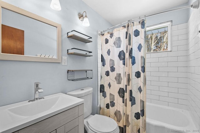 full bathroom featuring vanity, shower / bath combo with shower curtain, and toilet