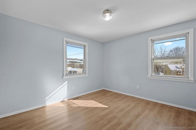 empty room with light wood-type flooring