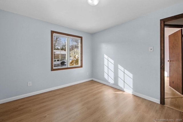 empty room with wood-type flooring