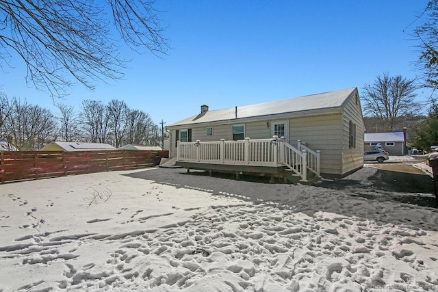 rear view of house featuring a deck