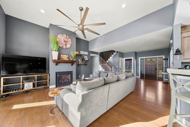 living room featuring ceiling fan and light wood-type flooring