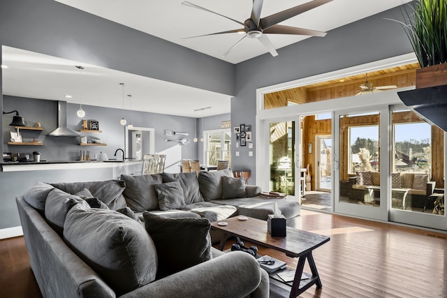 living room featuring hardwood / wood-style flooring and ceiling fan