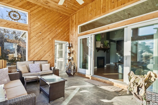 sunroom / solarium with wooden ceiling and ceiling fan