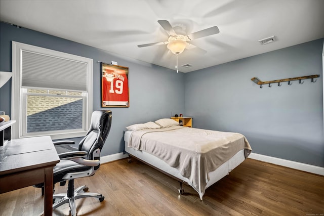 bedroom featuring wood-type flooring and ceiling fan