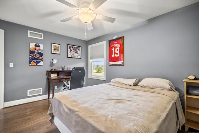 bedroom featuring dark hardwood / wood-style floors and ceiling fan