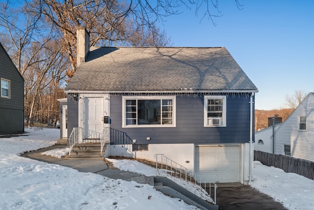 view of front of property with a garage