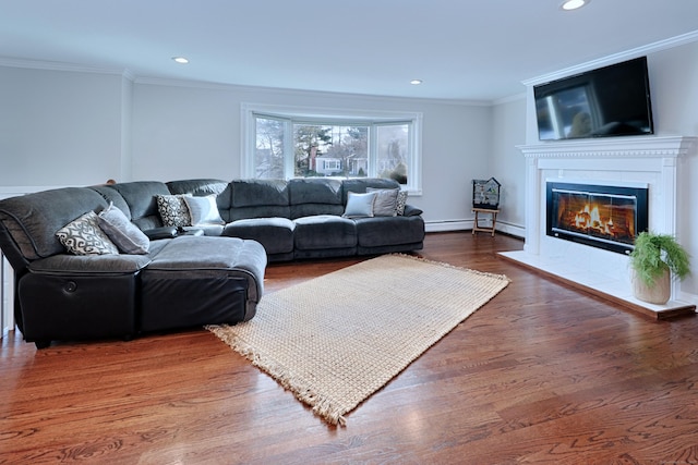 living room with dark wood-type flooring and ornamental molding