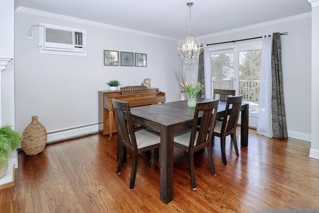 dining space featuring baseboard heating, hardwood / wood-style floors, ornamental molding, an AC wall unit, and a chandelier