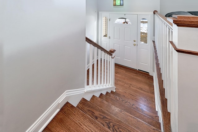 stairs with hardwood / wood-style flooring