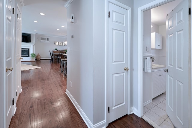 corridor featuring hardwood / wood-style floors