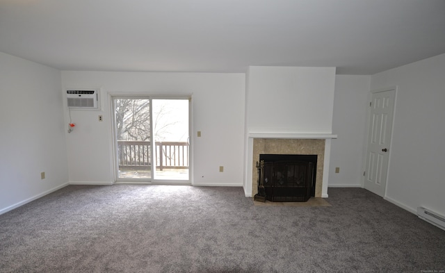 unfurnished living room with a tile fireplace, an AC wall unit, dark carpet, and baseboard heating