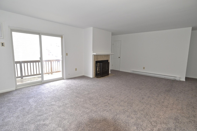 unfurnished living room featuring a tiled fireplace, carpet, and baseboard heating