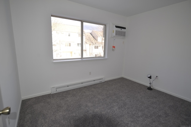 carpeted spare room with a baseboard radiator and a wall unit AC