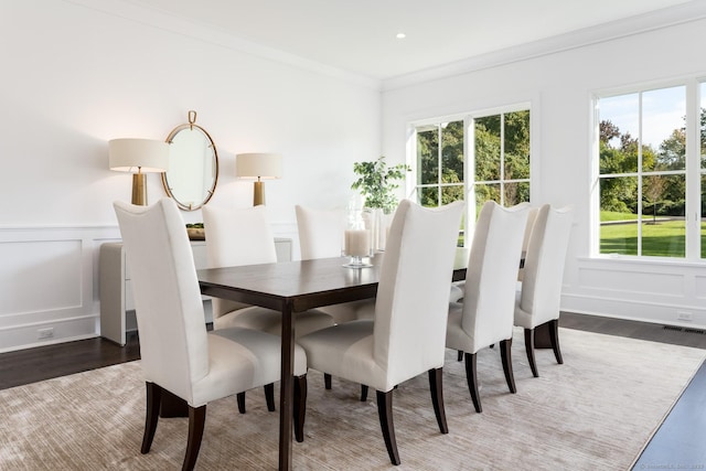 dining room featuring dark wood-type flooring and ornamental molding