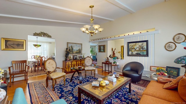 living room featuring beamed ceiling, hardwood / wood-style floors, and an inviting chandelier