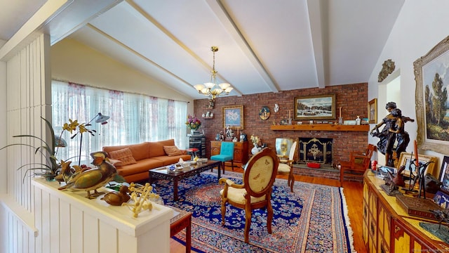 4 Alpine Dr, South Windsor, CT 06074 - living area featuring an inviting chandelier, brick wall, a brick fireplace, lofted ceiling with beams, and wood finished floors
