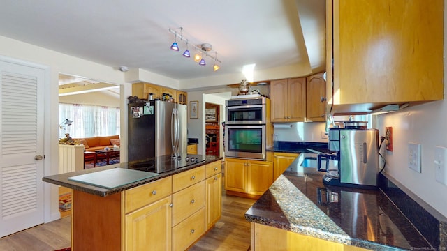 4 Alpine Dr, South Windsor, CT 06074 - kitchen with a center island, appliances with stainless steel finishes, light wood finished floors, and dark stone countertops