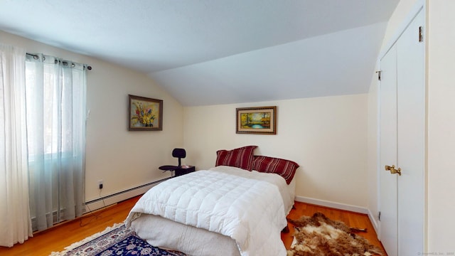 4 Alpine Dr, South Windsor, CT 06074 - bedroom featuring baseboard heating, light wood-style flooring, and lofted ceiling