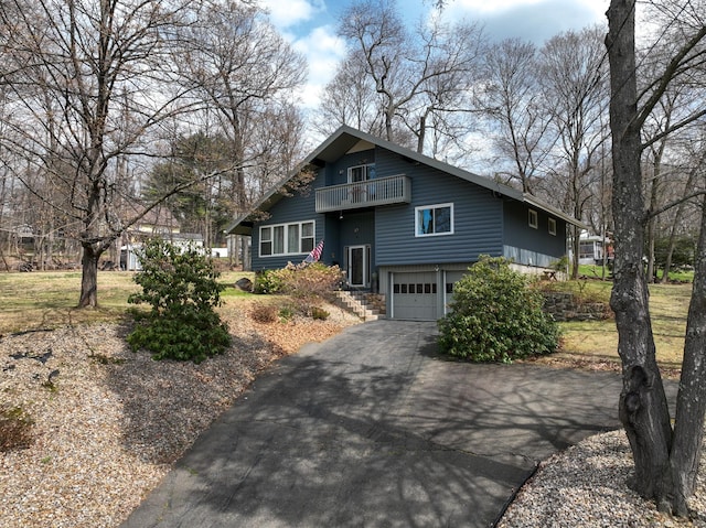 4 Alpine Dr, South Windsor, CT 06074 - view of front of home with aphalt driveway, an attached garage, and a balcony
