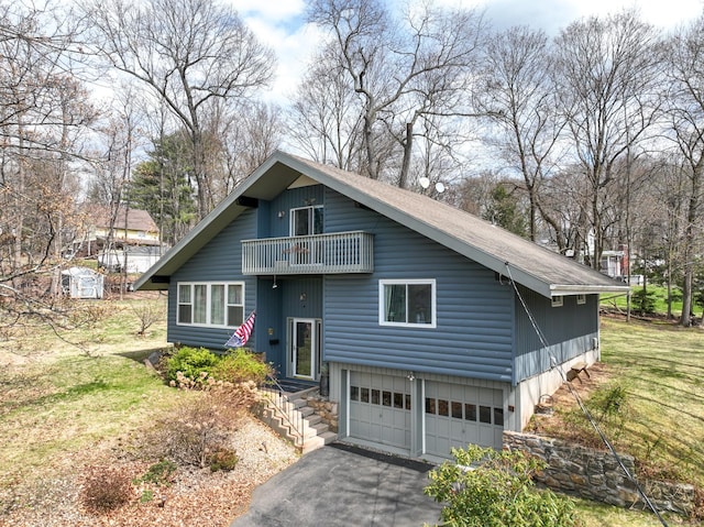 4 Alpine Dr, South Windsor, CT 06074 - view of front of house featuring a garage, driveway, a balcony, and a front lawn