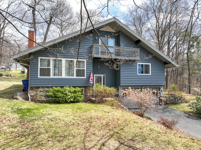4 Alpine Dr, South Windsor, CT 06074 - view of front of house with a chimney, an attached garage, a front lawn, and a balcony