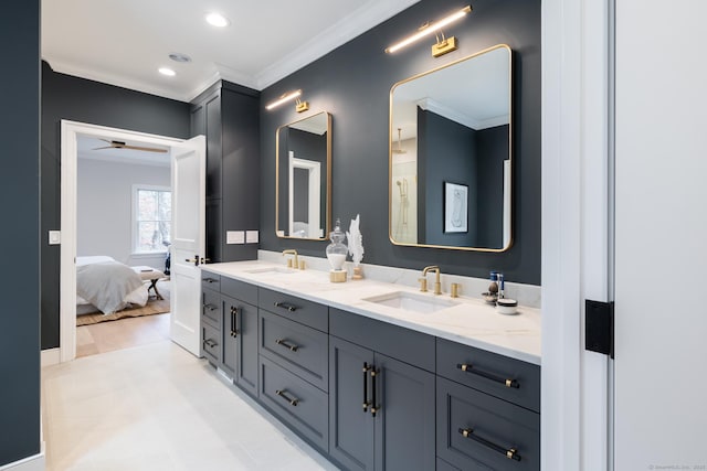 bathroom featuring ornamental molding and vanity