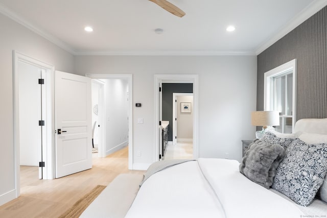 bedroom featuring ornamental molding and light hardwood / wood-style flooring